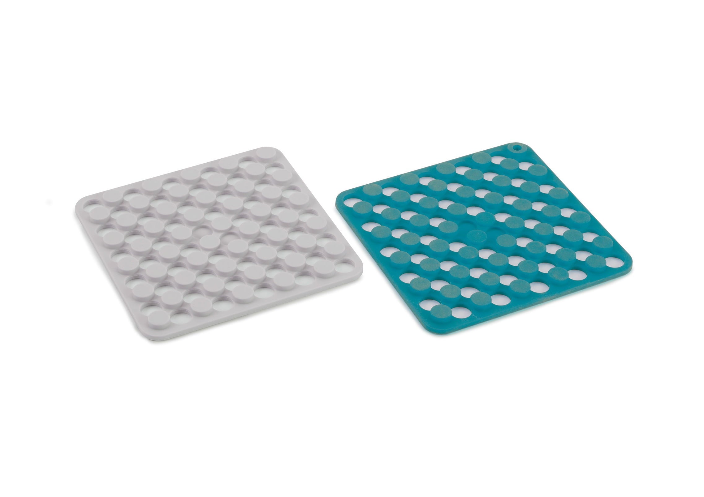 Joseph Joseph Duo 2-piece silicone trivets in Dark Opal and Stone shown side by side