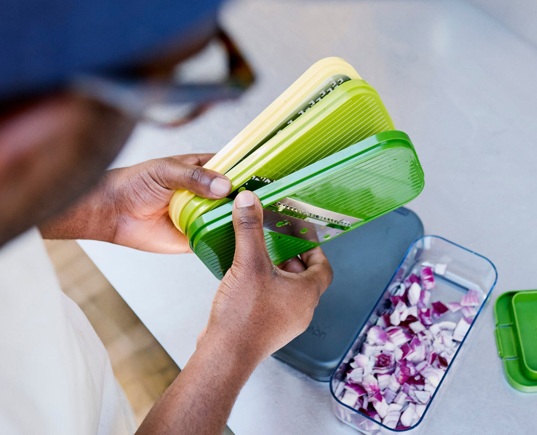 Joseph Joseph Multi-Prep Compact 4-Piece Preparation Set Multicolour 20222 — grater attachment in use