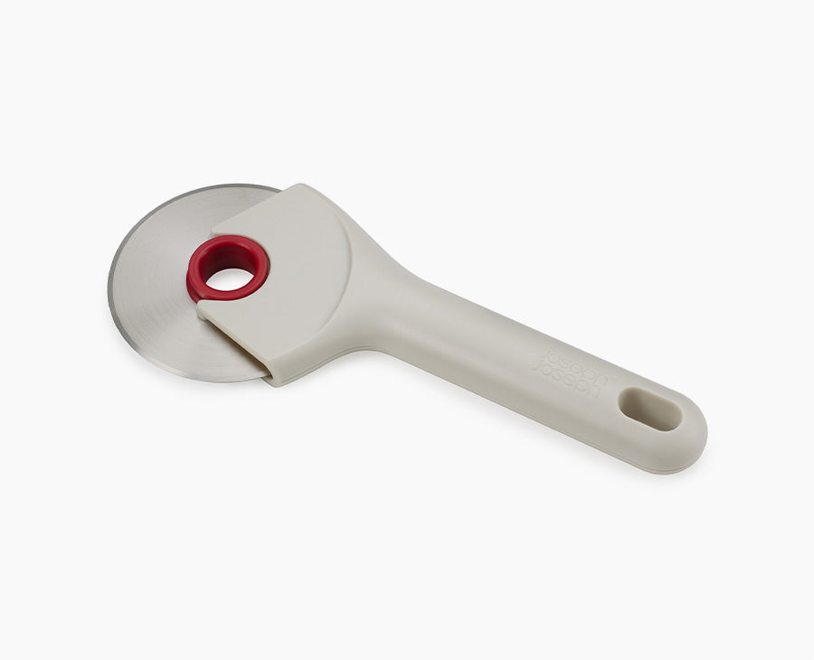 Joseph Joseph Ringo Easy-Clean Pizza Wheel Stone and Red 20232 — stone and red pizza wheel front view