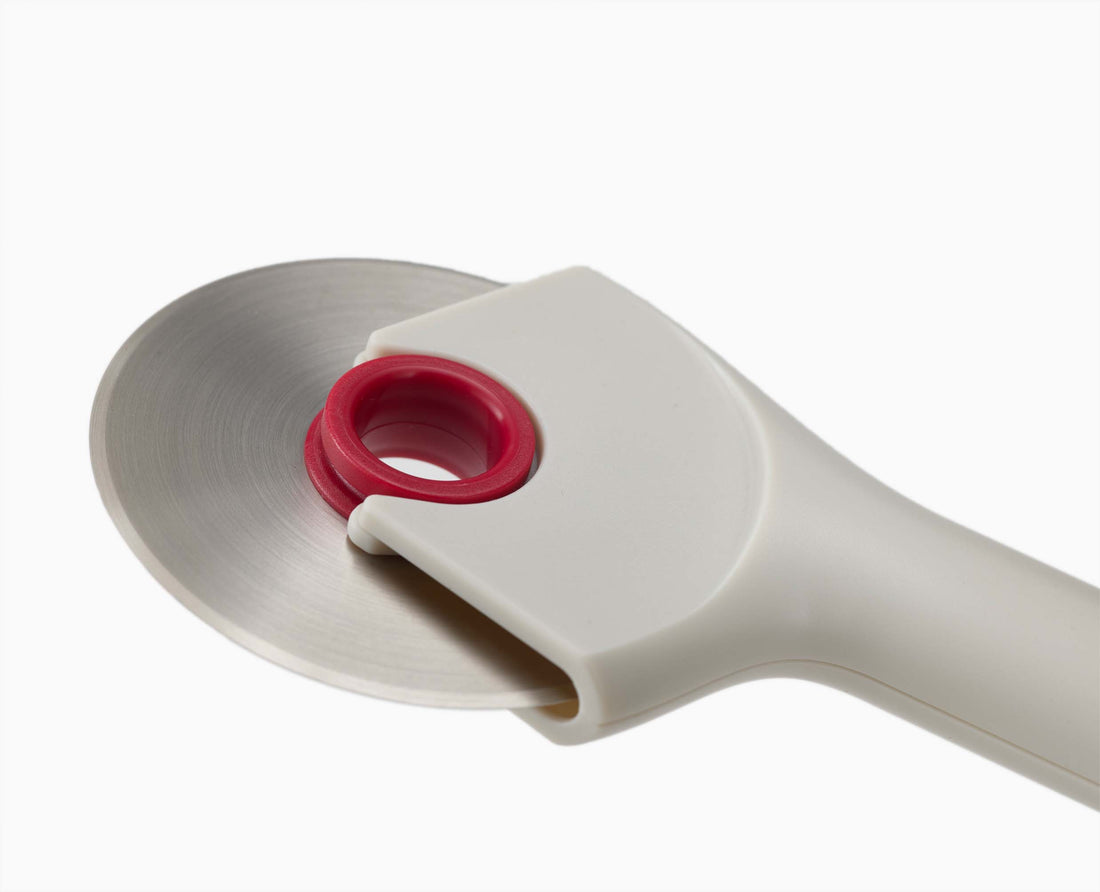 Joseph Joseph Ringo Easy-Clean Pizza Wheel Stone and Red 20232 — stainless-steel cutting blade detail