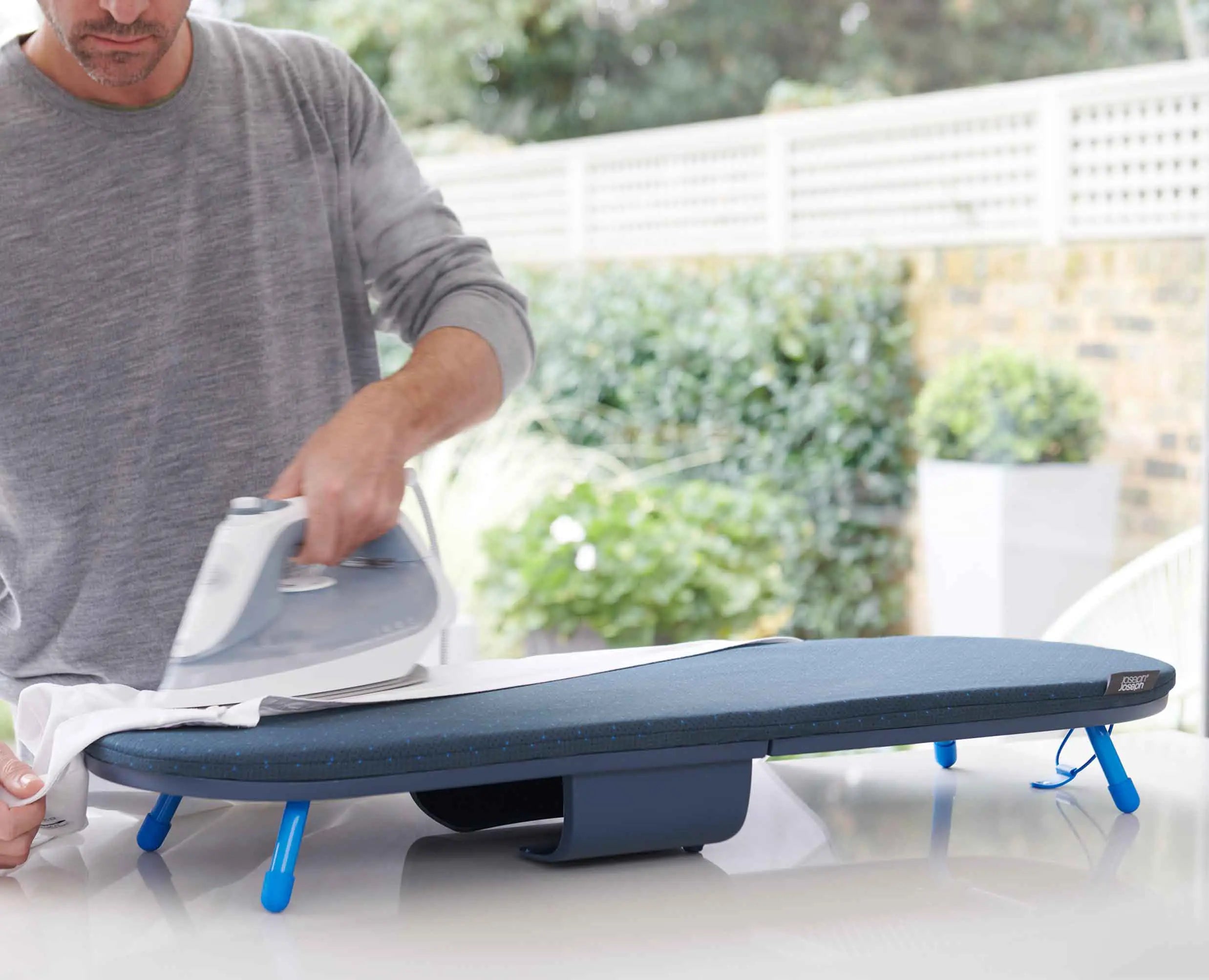 Joseph Joseph Pocket Plus Folding Tabletop Ironing Board Blue 50010 — tabletop ironing board lifestyle view