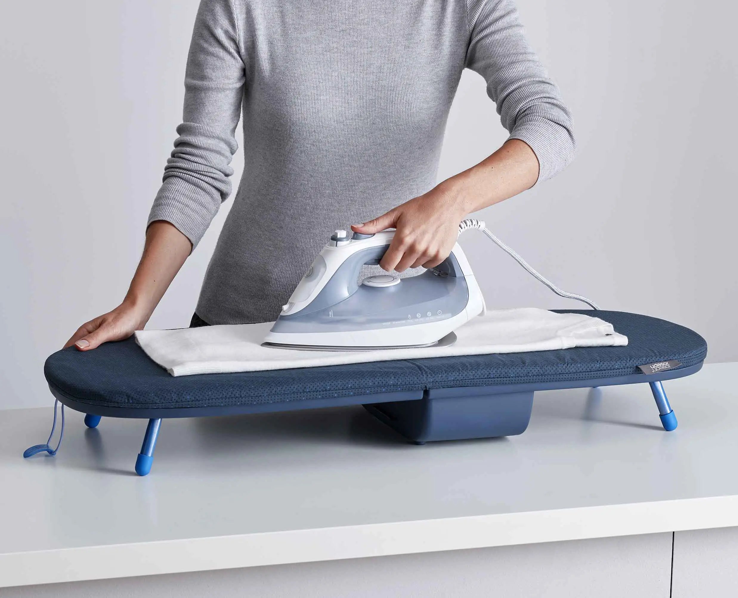Joseph Joseph Pocket Plus Folding Tabletop Ironing Board Blue 50010 — DripLock cover and folding feature diagram