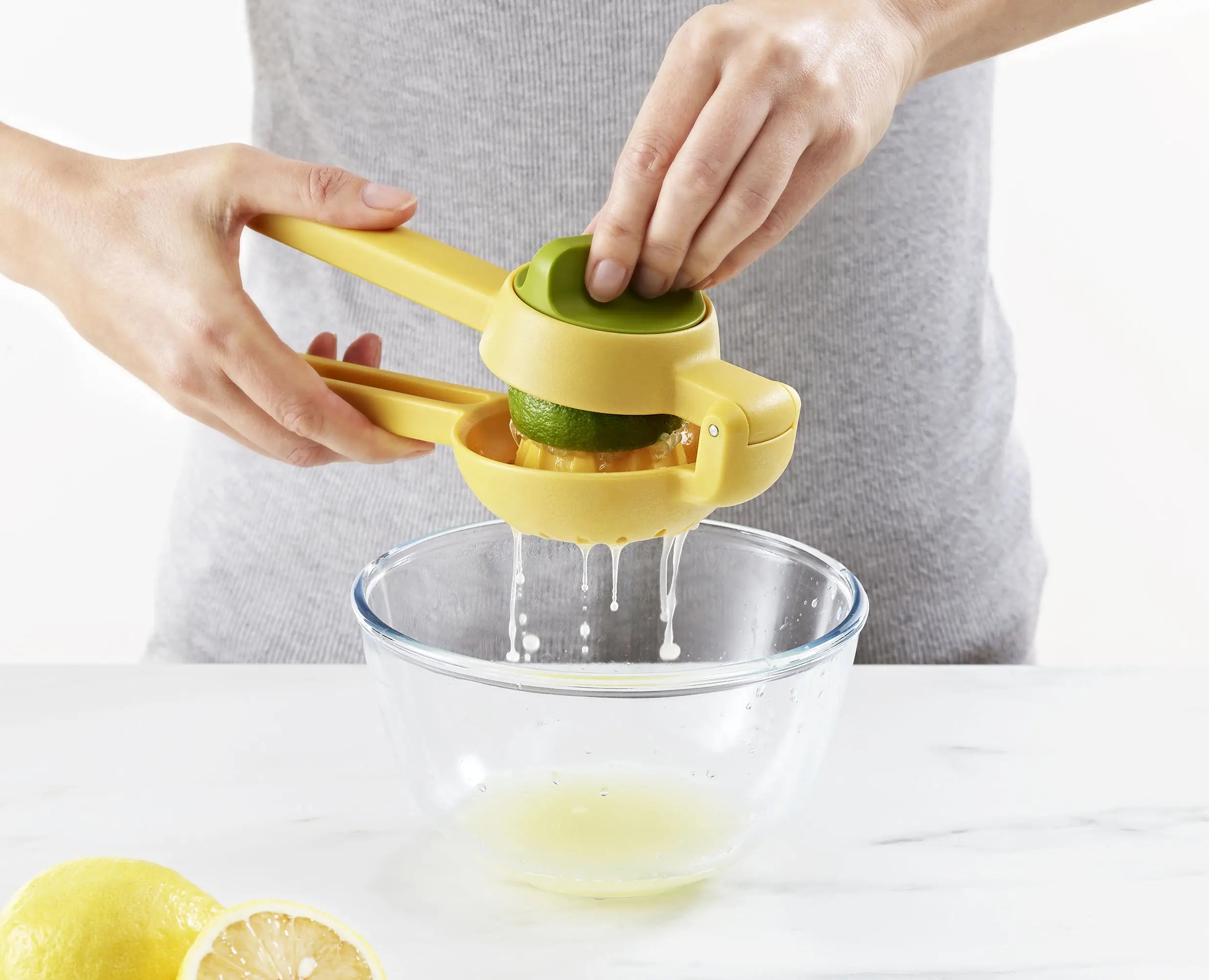 Joseph Joseph JuiceMax 20171 yellow citrus press lifestyle view