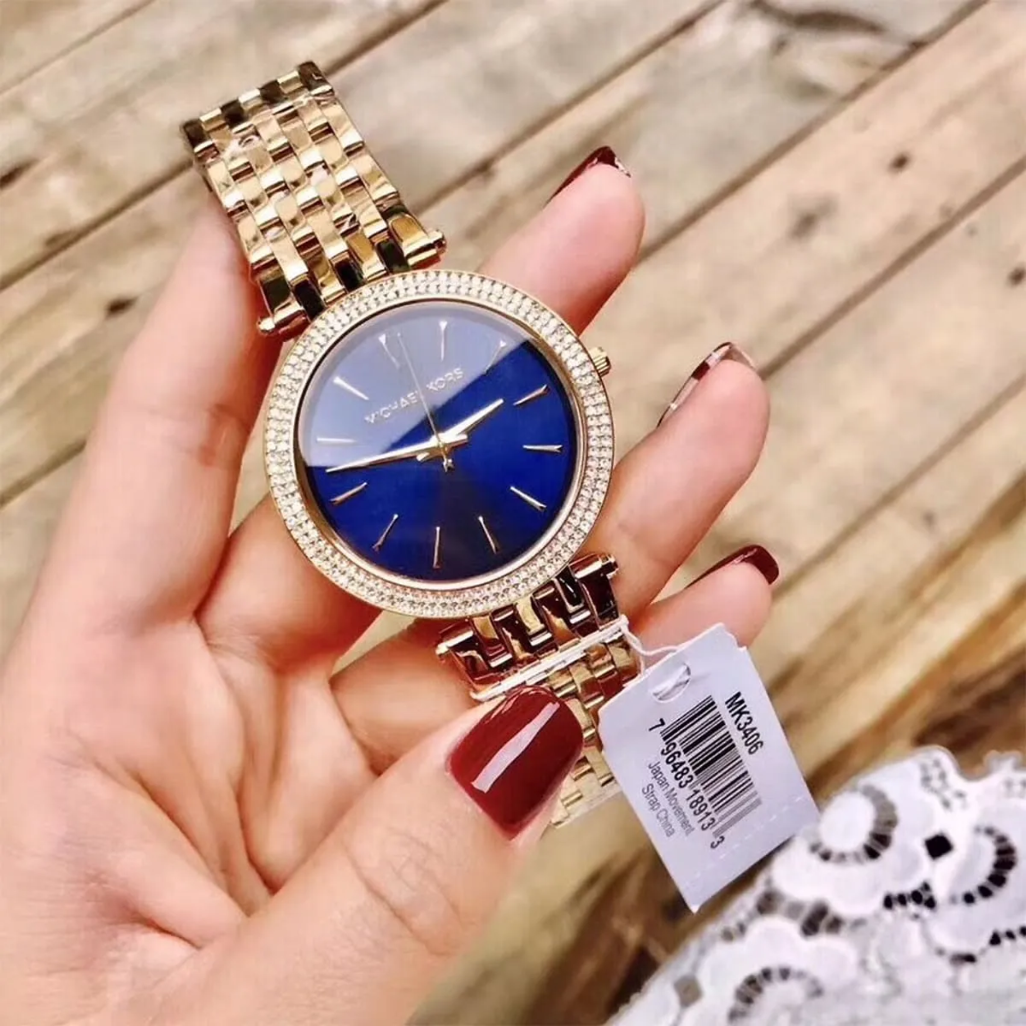 Michael Kors Darci MK3406 gold-tone bracelet watch handheld front view