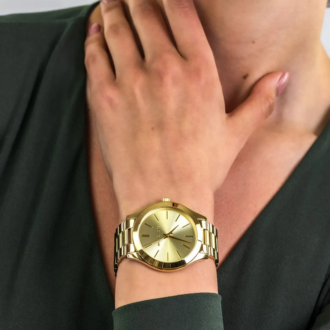 Michael Kors MK3179 gold-tone watch close wrist lifestyle view