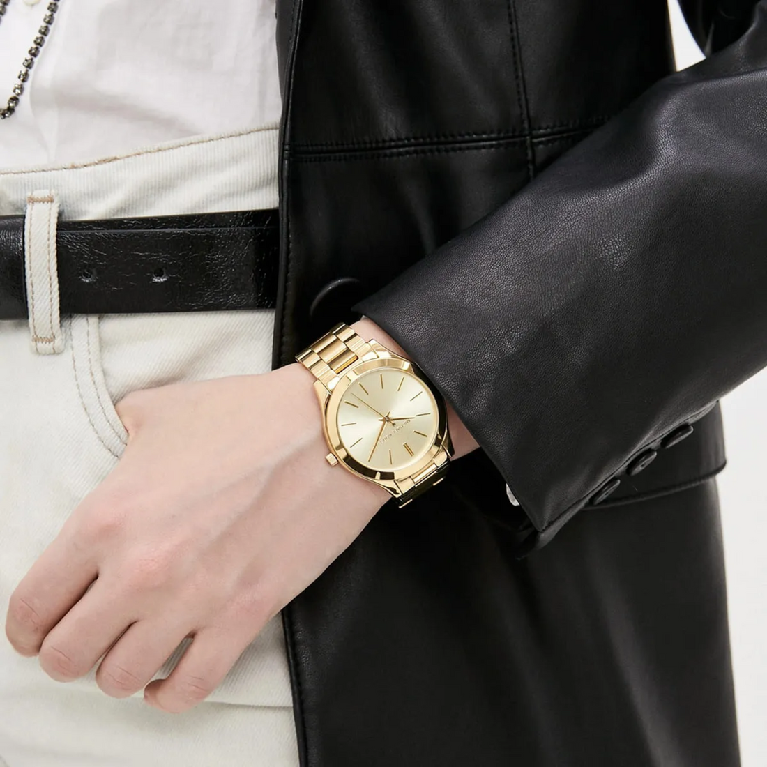 Michael Kors MK3179 gold-tone watch with black leather jacket