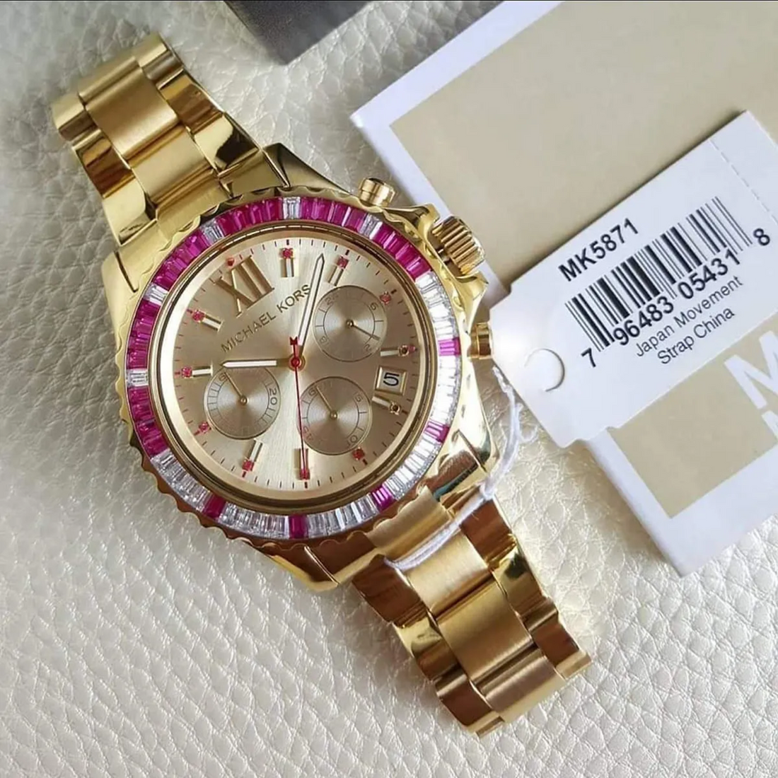 Michael Kors MK5871 gold-tone watch with model identification tag