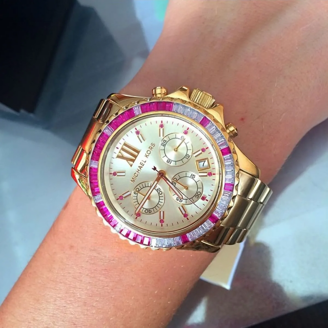 Michael Kors MK5871 gold-tone chronograph watch worn on wrist
