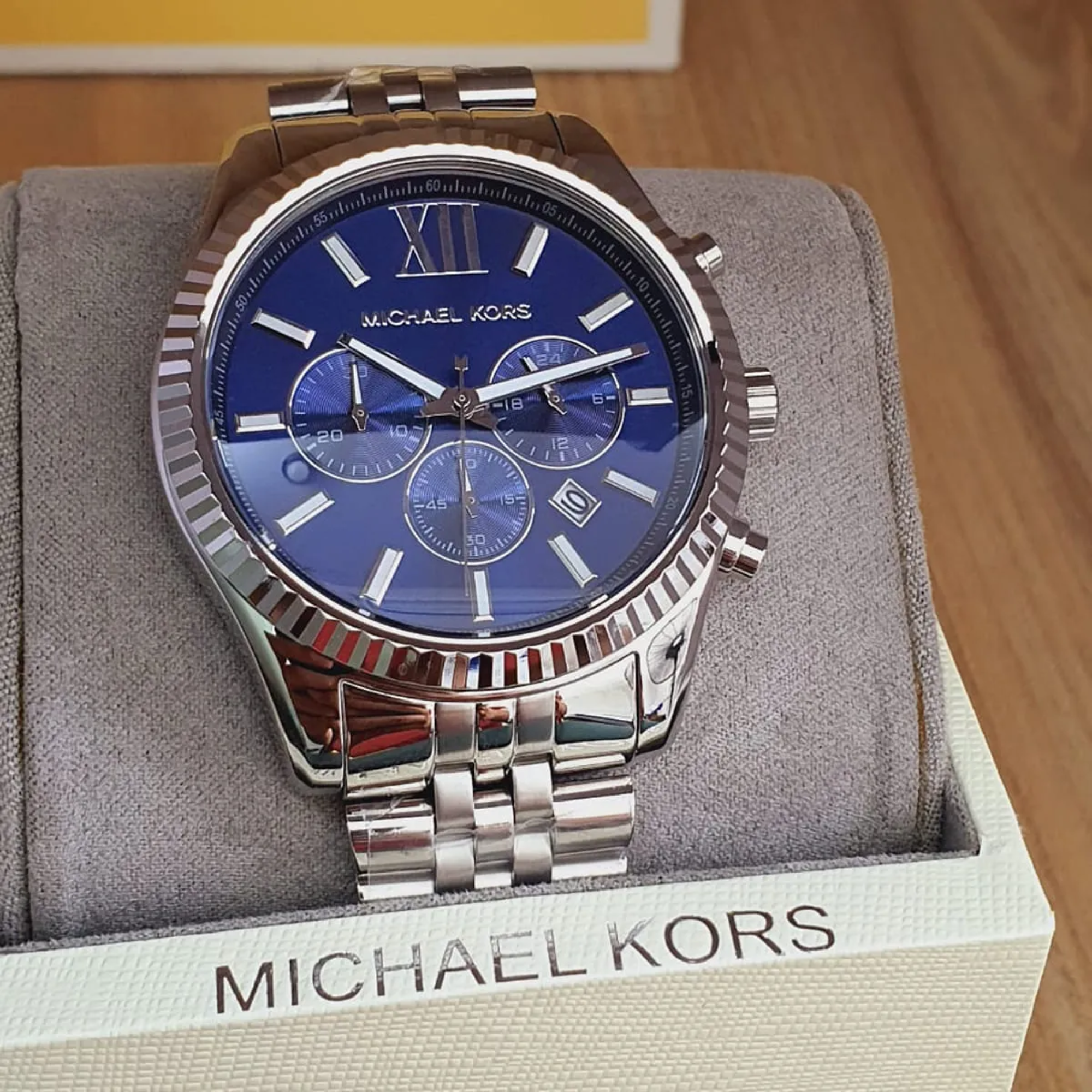 Michael Kors MK8280 navy dial chronograph watch close-up on wrist