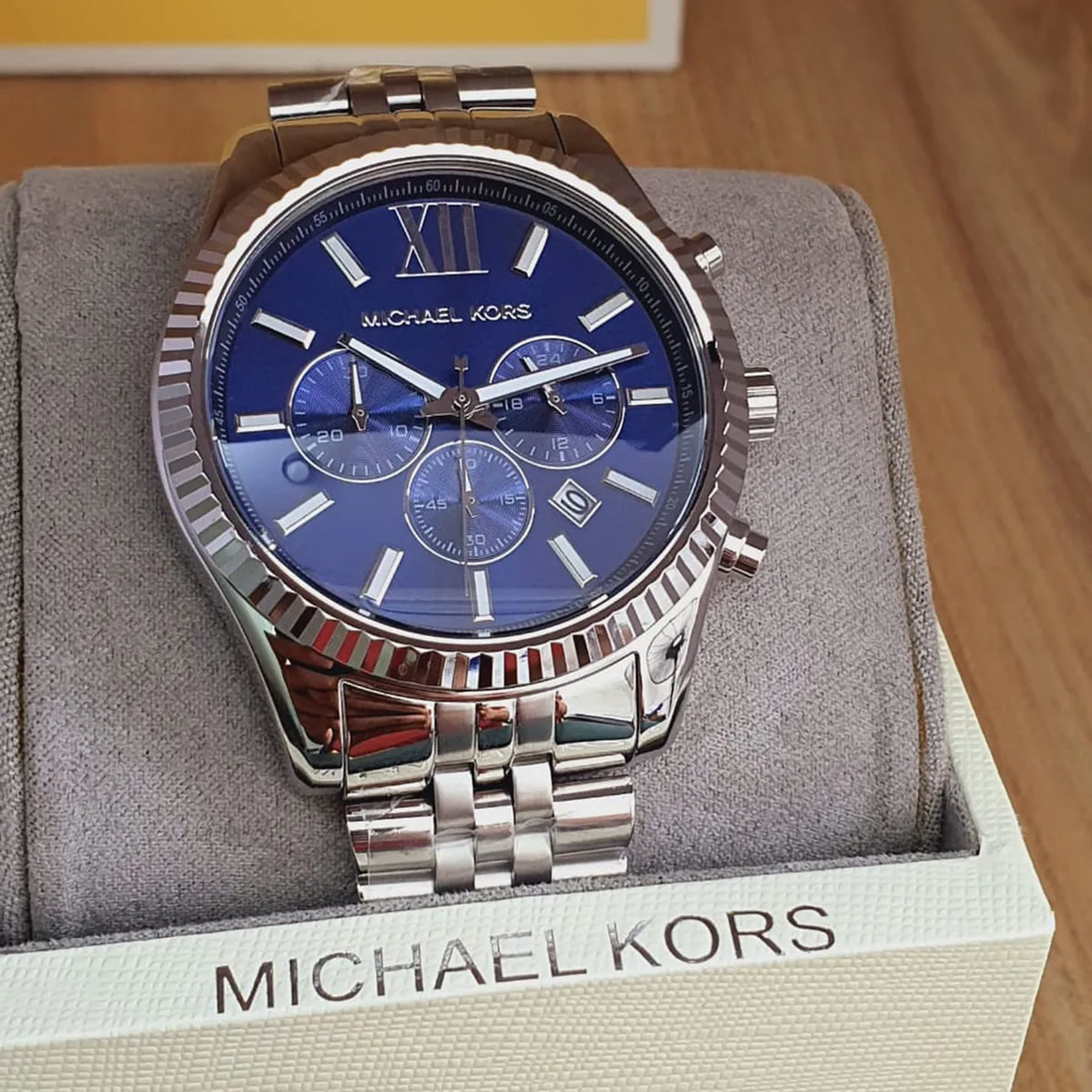 Michael Kors MK8280 navy dial chronograph watch close-up on wrist