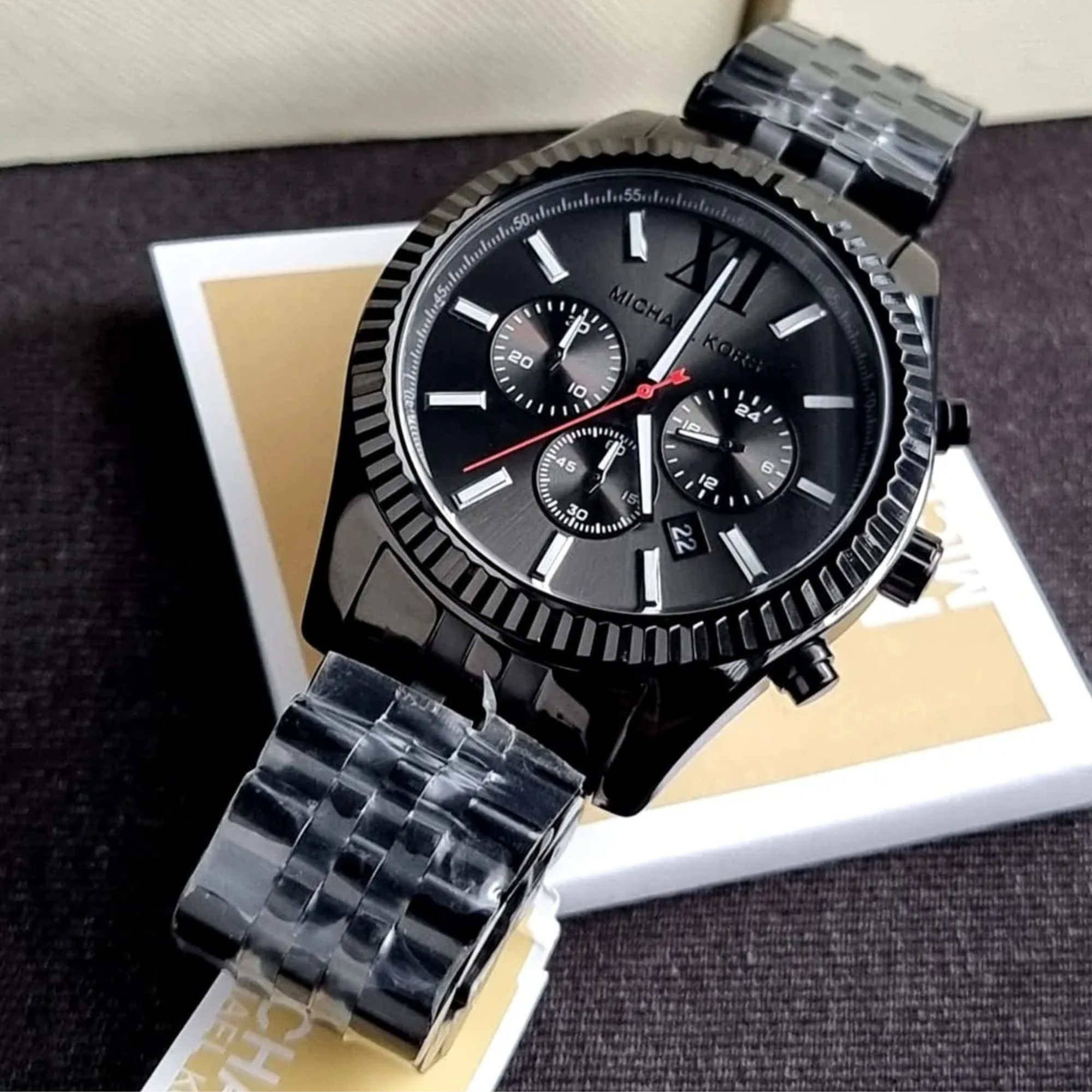 Michael Kors MK8320 black-tone chronograph watch displayed with Michael Kors box