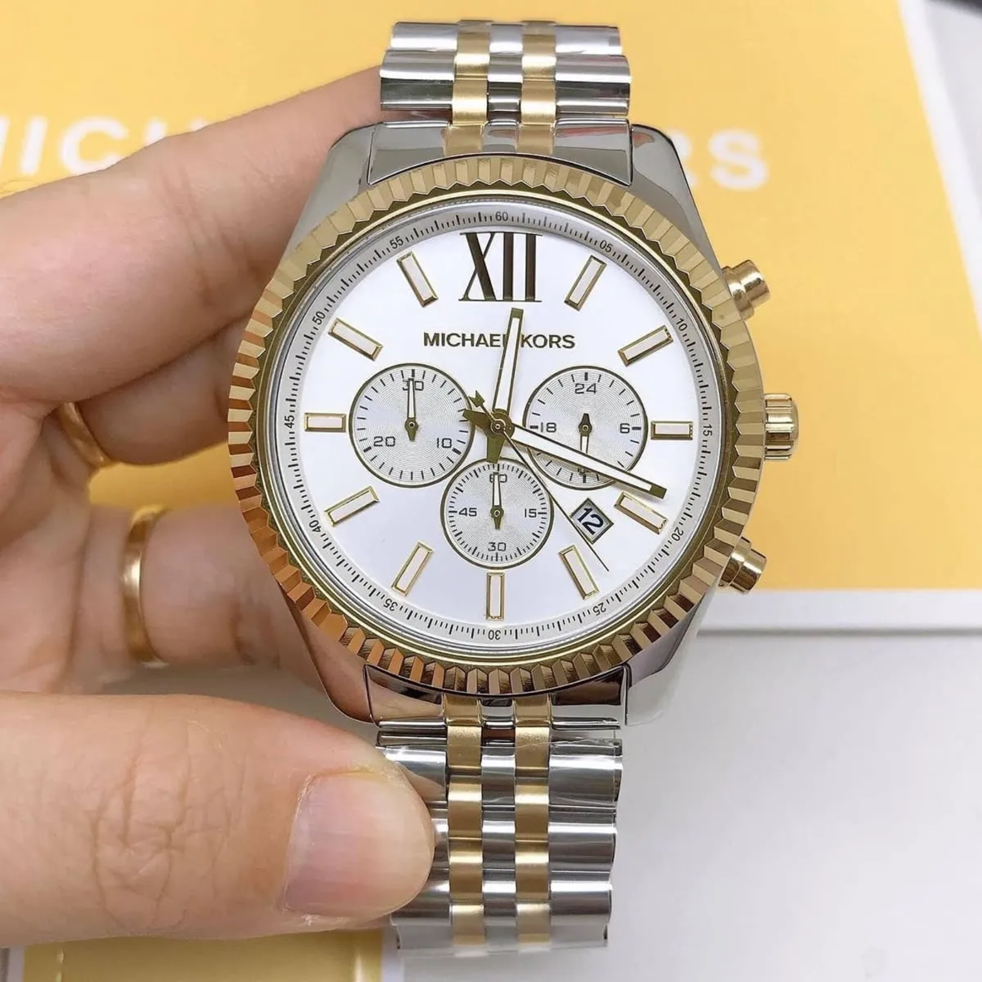 Michael Kors MK8344 Lexington silver and gold-tone chronograph handheld view