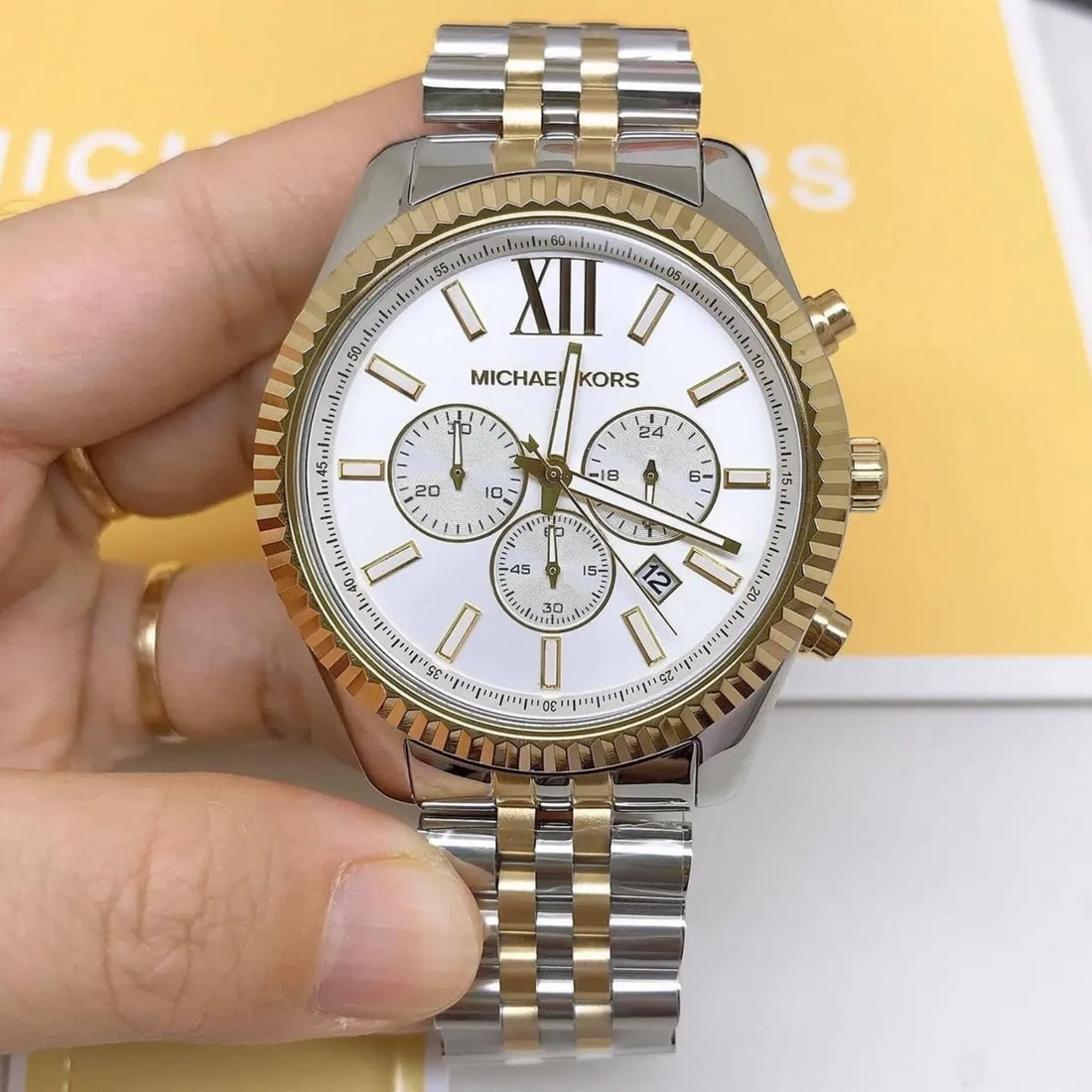 Michael Kors MK8344 Lexington silver and gold-tone chronograph handheld view