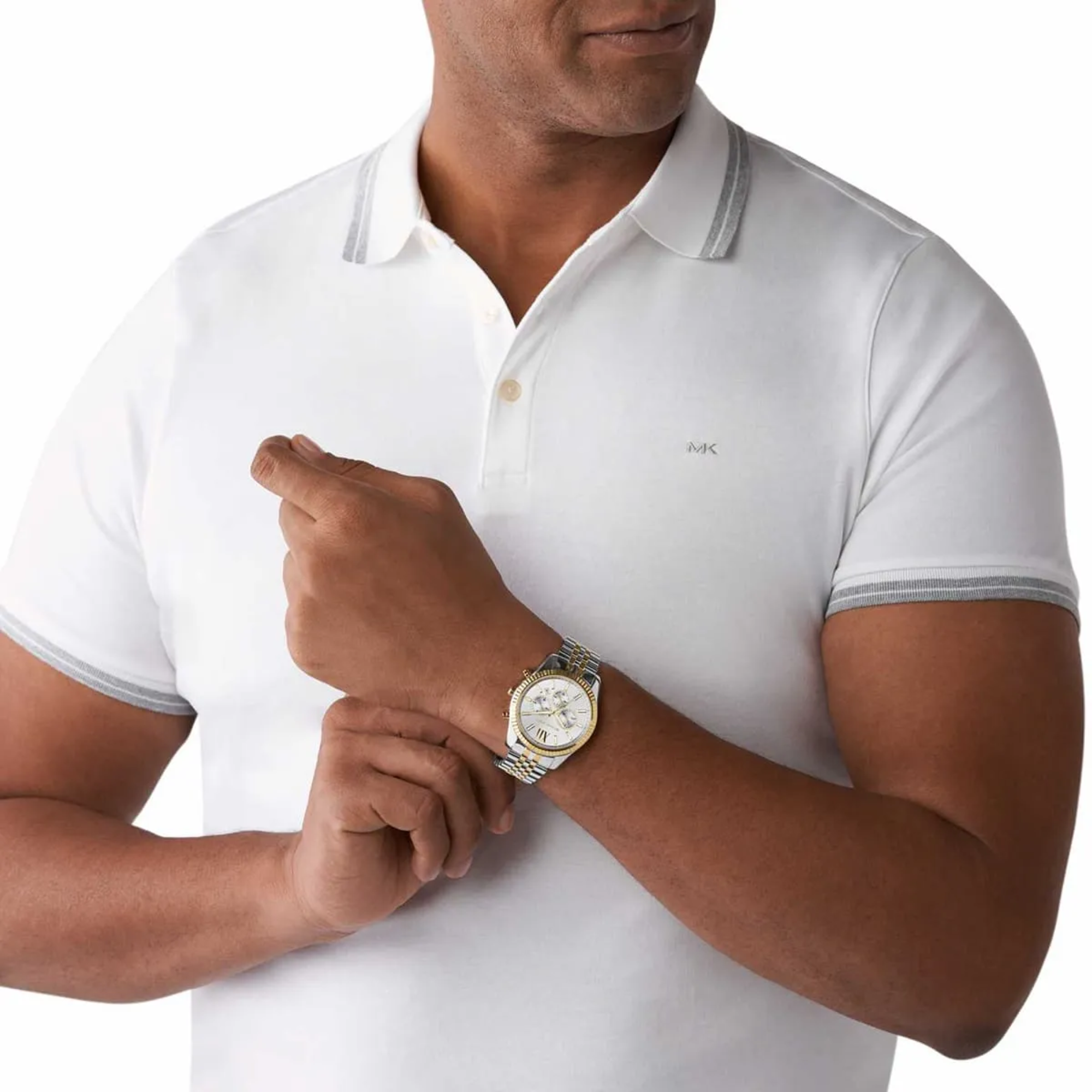 Michael Kors Lexington MK8344 two-tone watch worn with white polo shirt