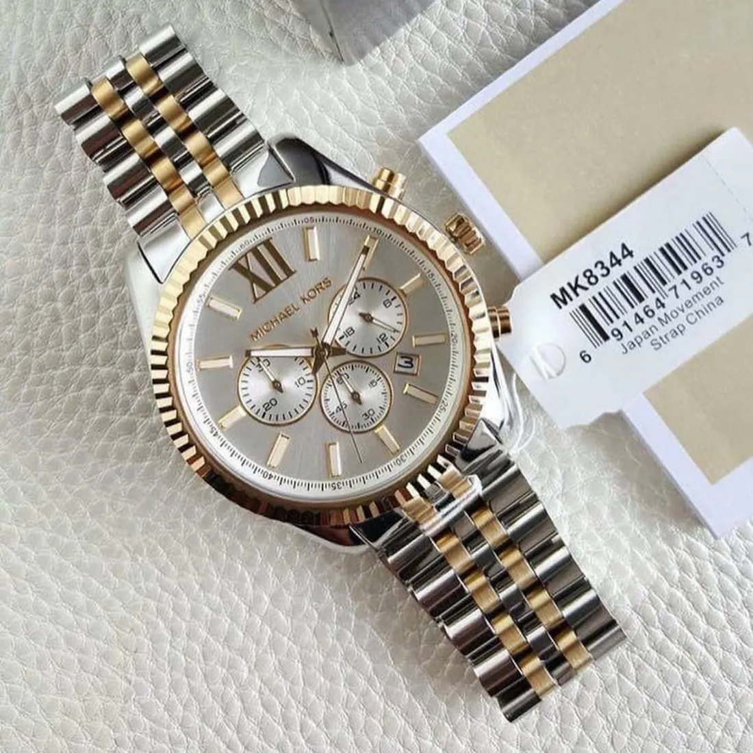 Michael Kors Lexington MK8344 watch with model tag and two-tone bracelet