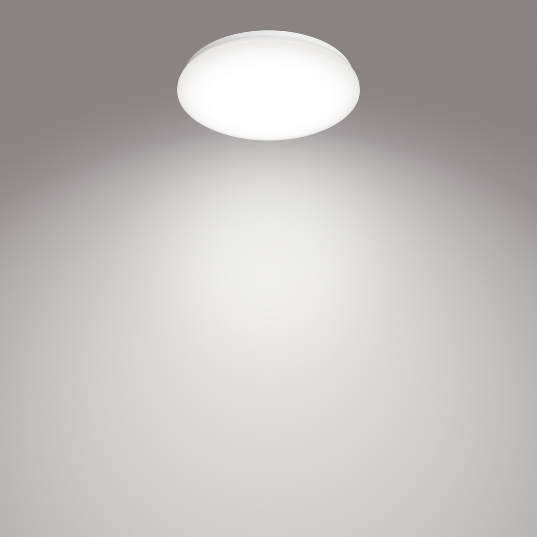 Philips Moire CL200 round ceiling light illuminated on a ceiling